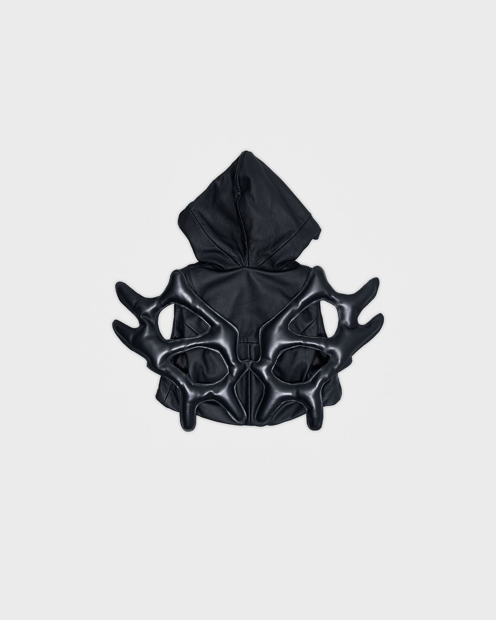 - Hodded leather vest<br />- Slim fit <br />- Back feature detachable leather wings