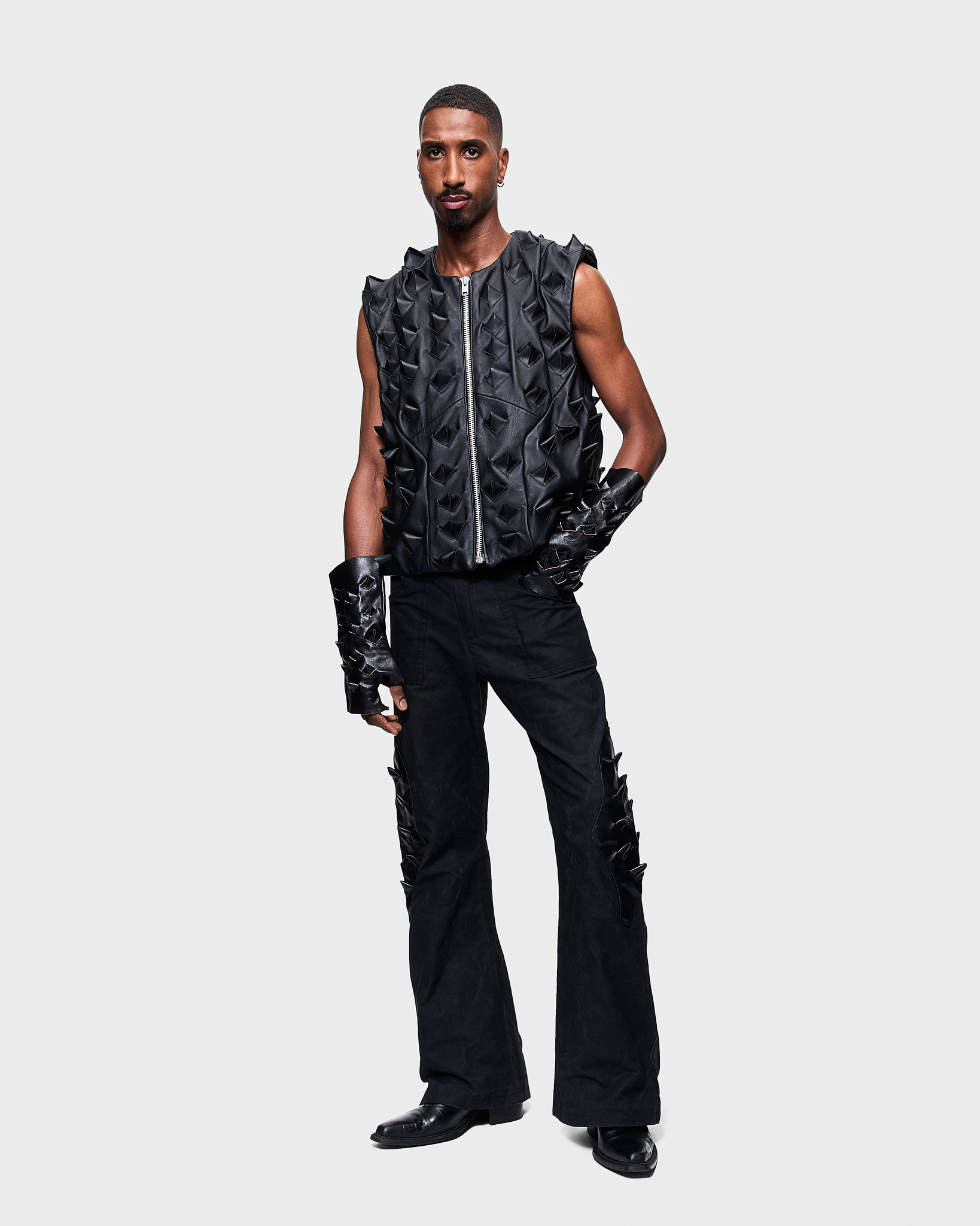 - Leather vest<br />- Oversized fit<br />- Croco 3-D leather are applied all over the vest