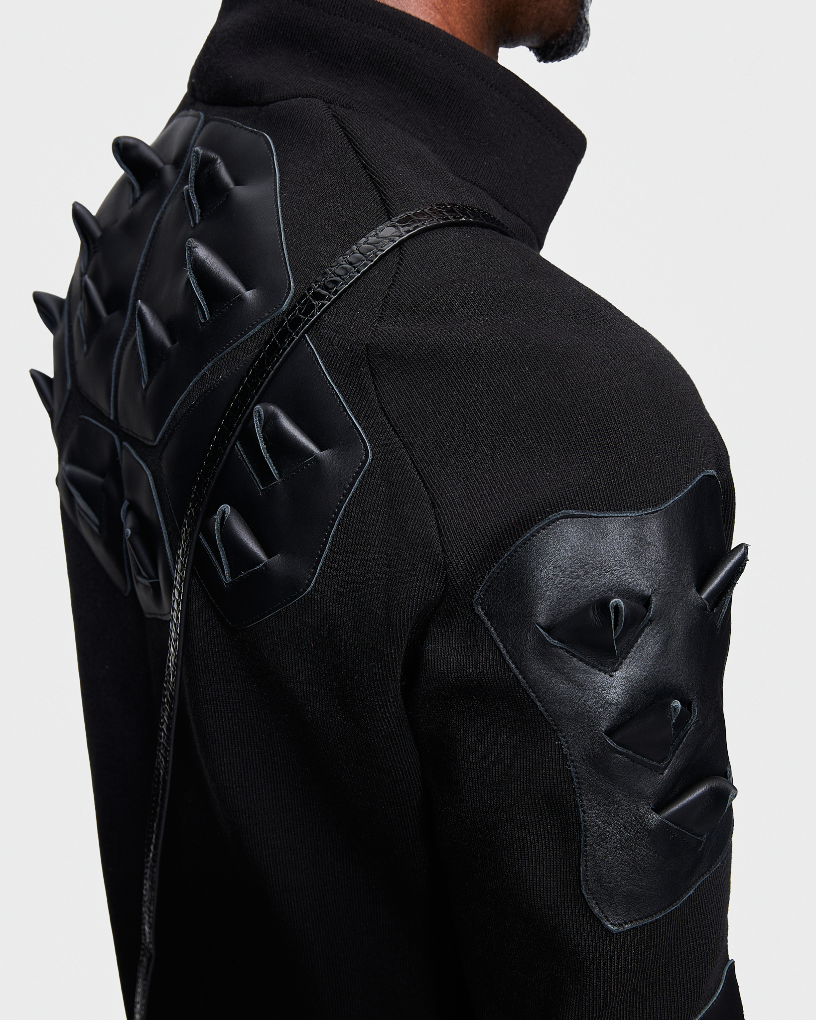 - Full zip pull over <br />- Slim fit<br />- Croco 3-D leather patches