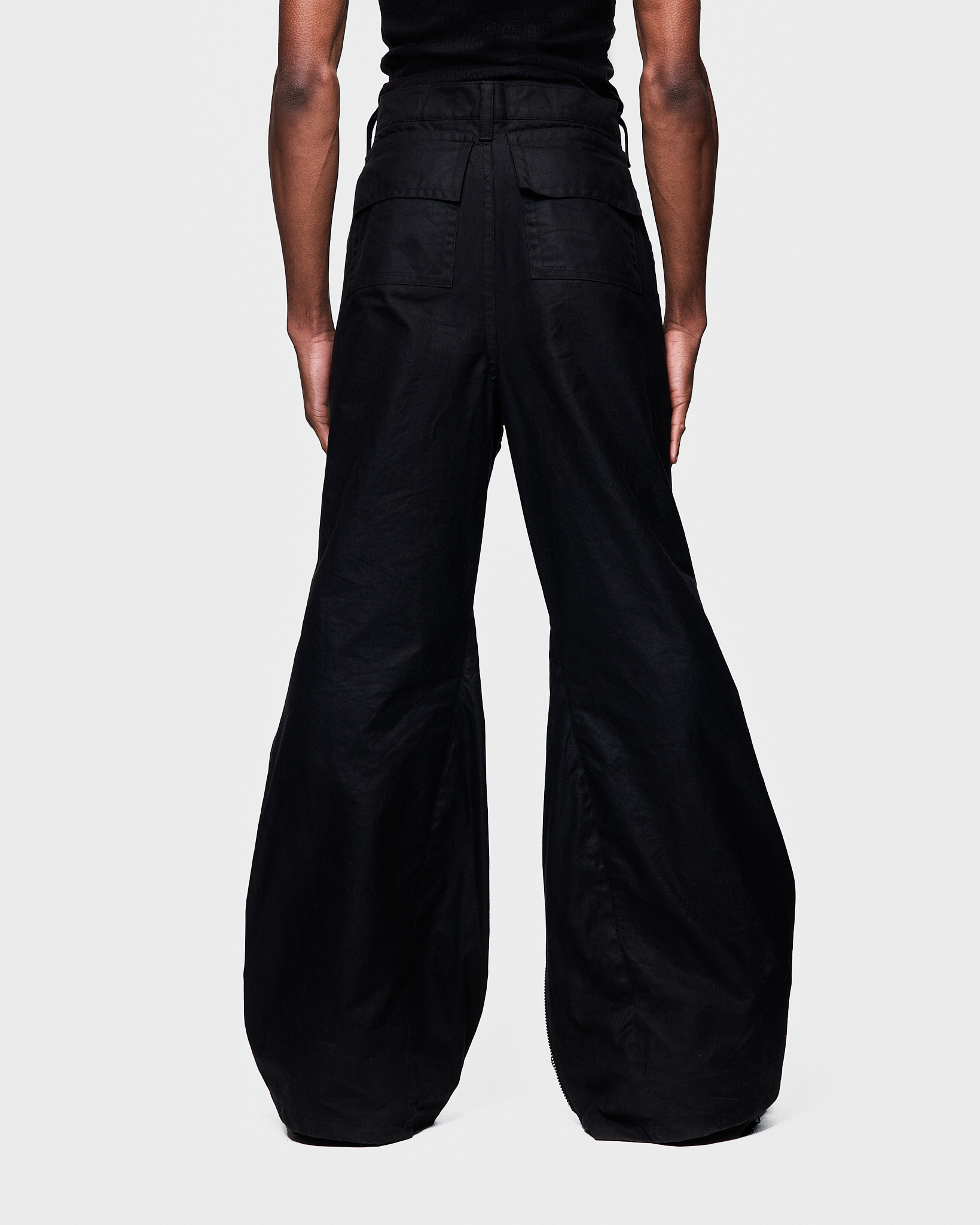 - Slim fit with bootcut leg<br />- Front feature an elogated zipper that reveals a croco 3-D leather panel