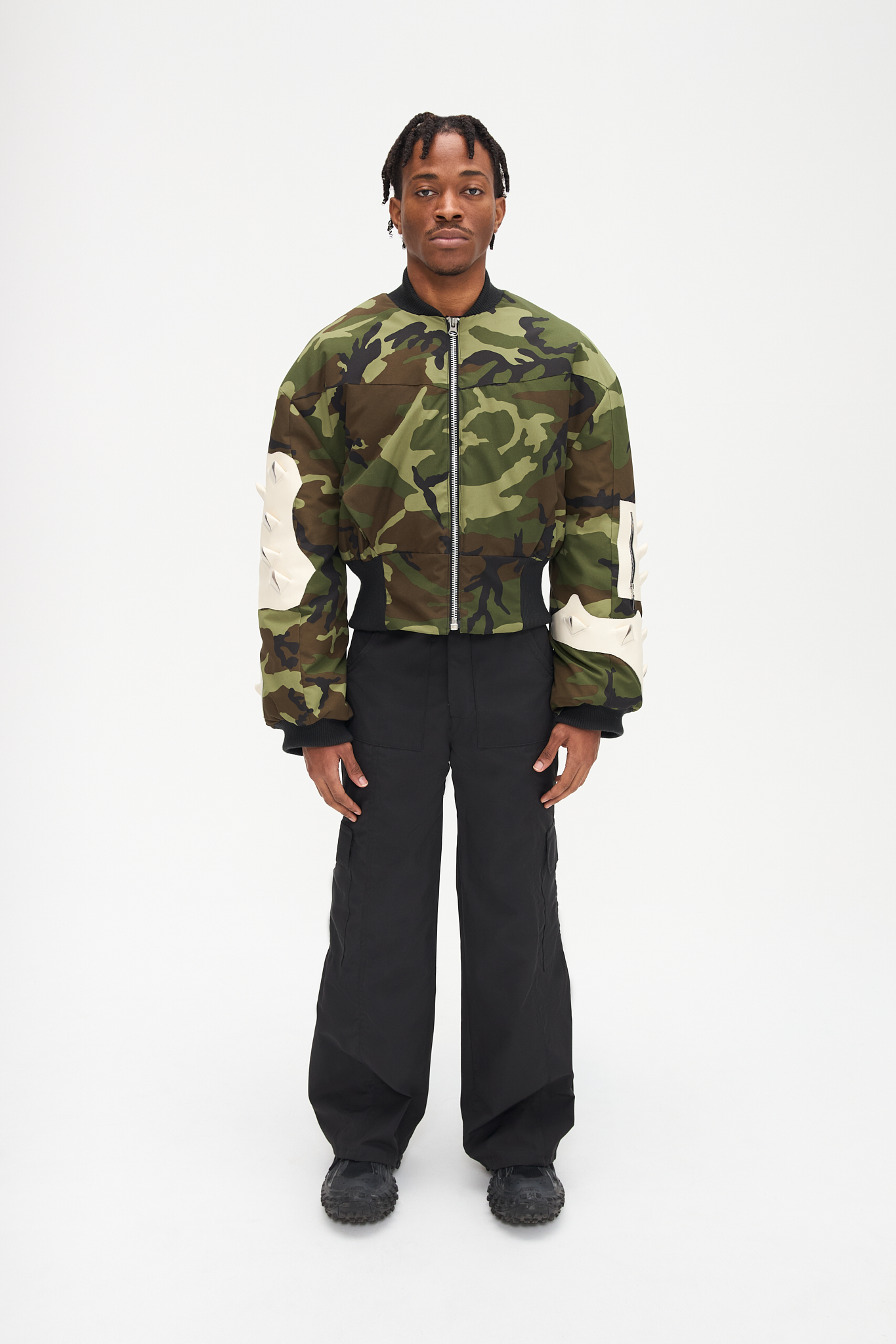 - Oversize fit<br />- Croptop bomber<br />- Nylon water resistant fabric<br />- White croco 3-D natural leather patches<br />