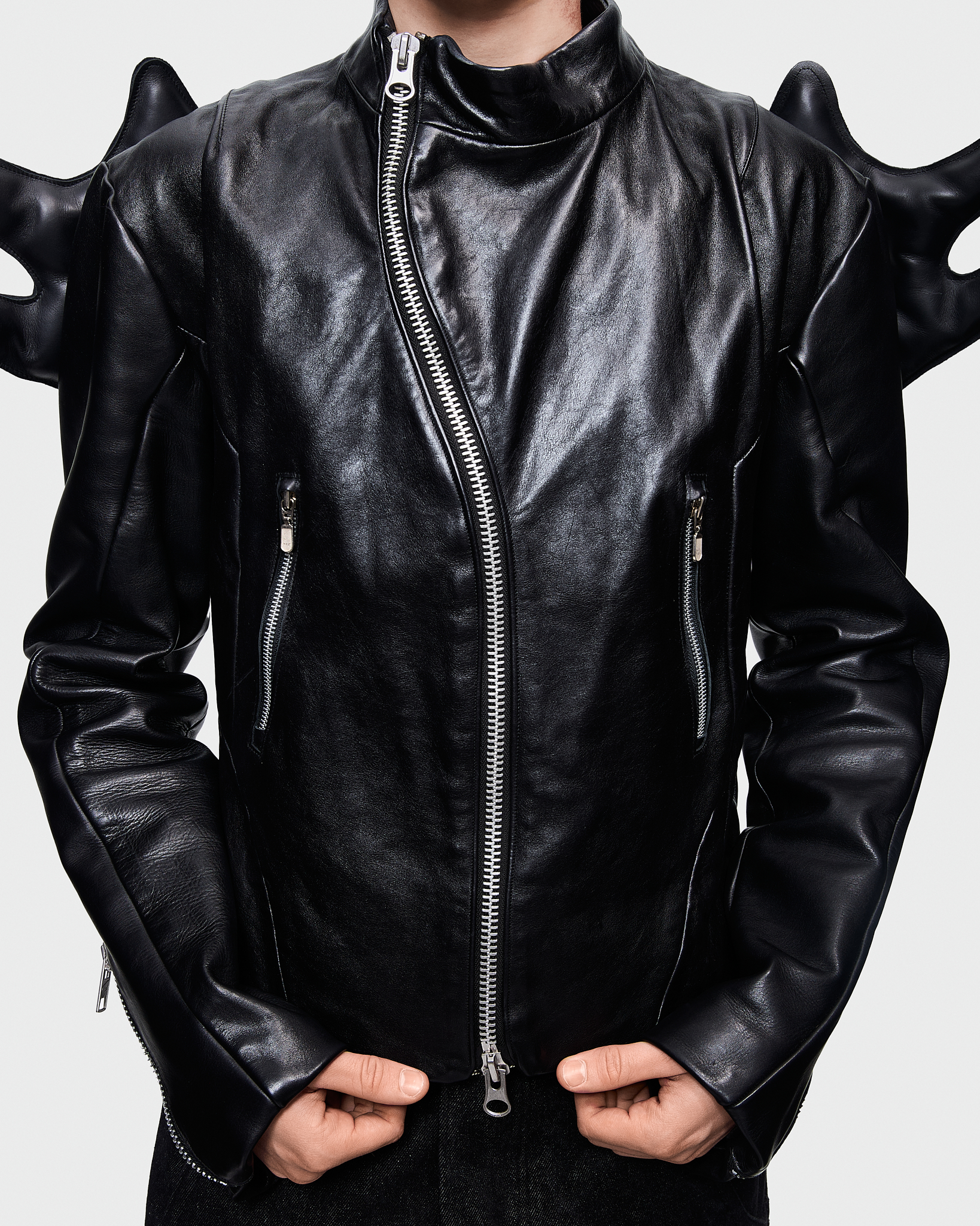 - Biker leather jacket<br />- Straight fit <br />- Back feature detachable leather wings<br />- Off center zipper