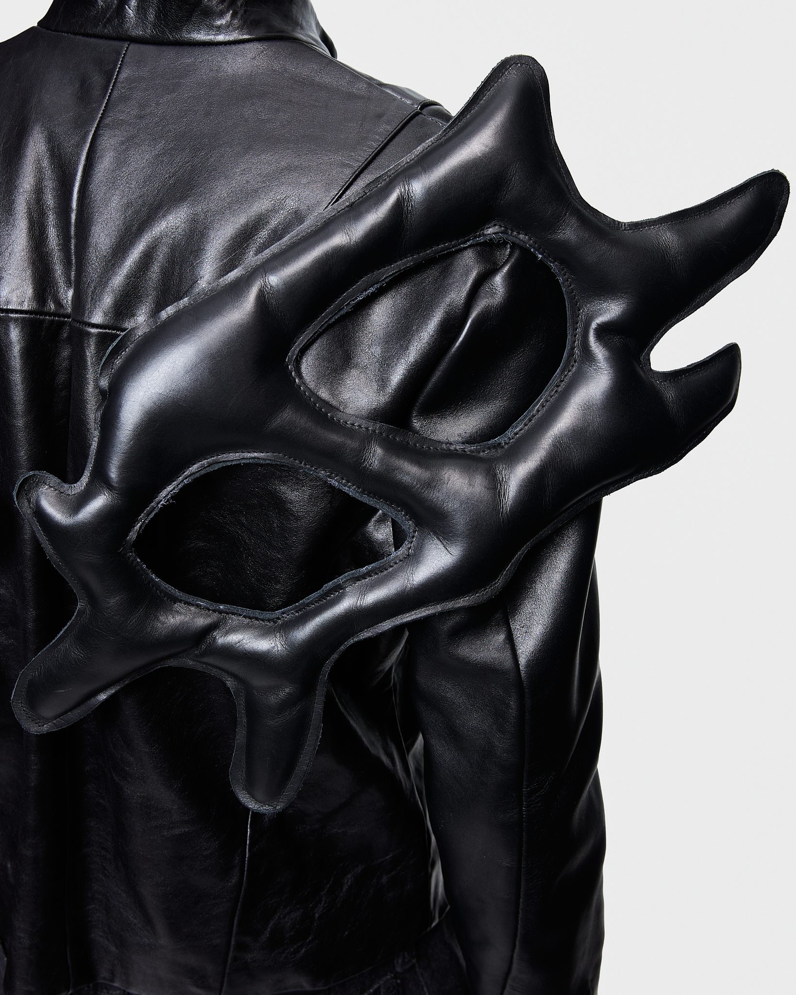 - Biker leather jacket<br />- Straight fit <br />- Back feature detachable leather wings<br />- Off center zipper