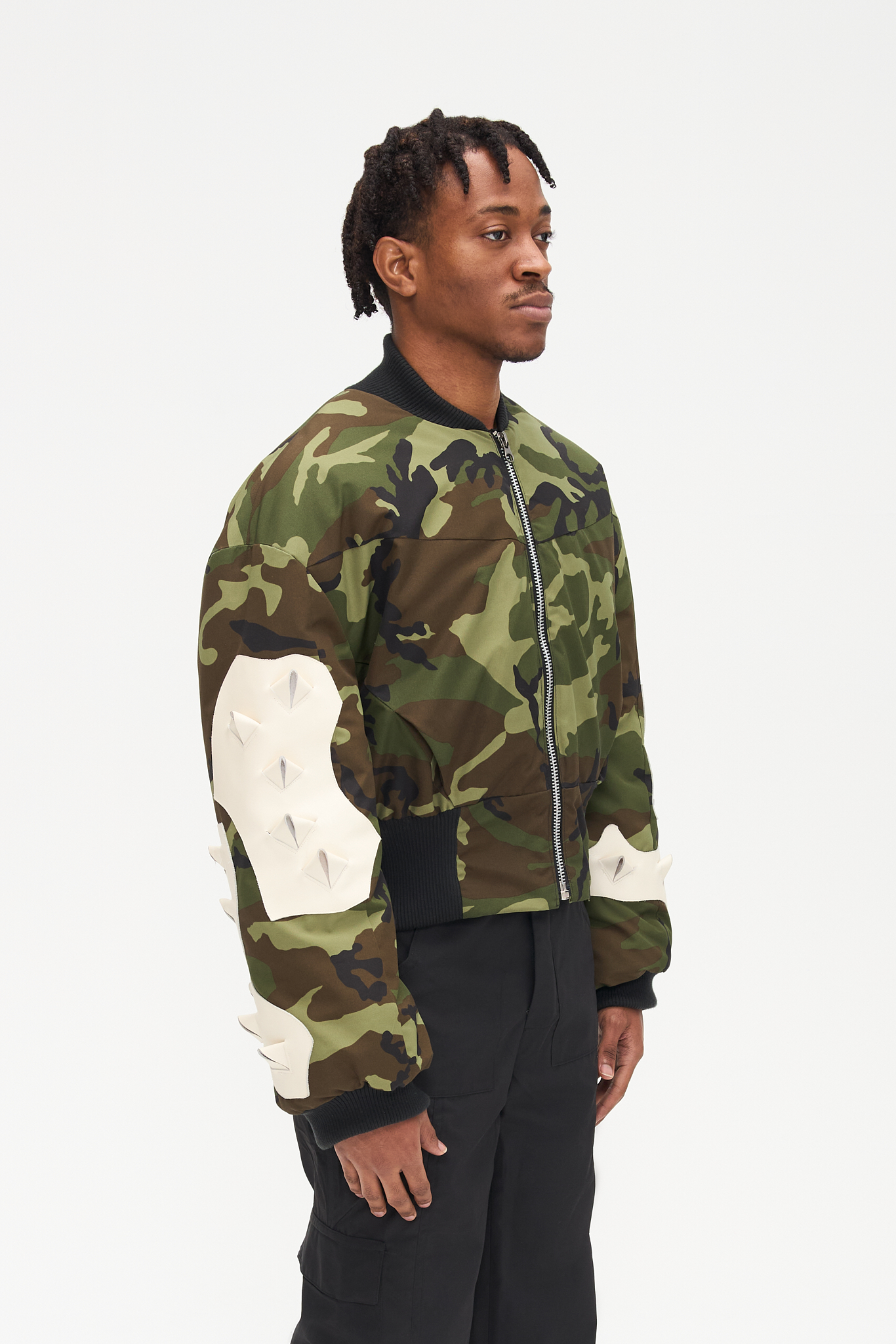 - Oversize fit<br />- Croptop bomber<br />- Nylon water resistant fabric<br />- White croco 3-D natural leather patches<br />