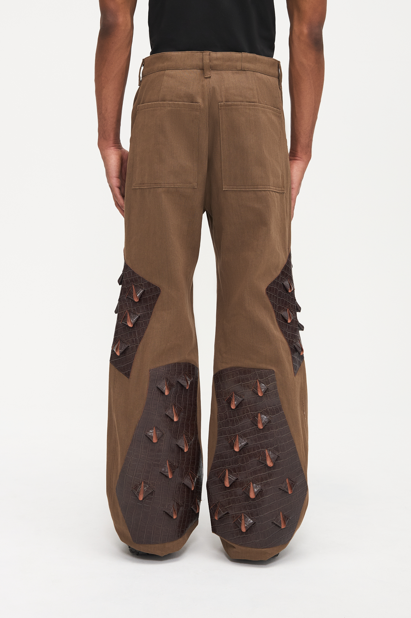 - Flared fit<br />- Deadstock brown denim<br />- Brown croco 3-D leather patches